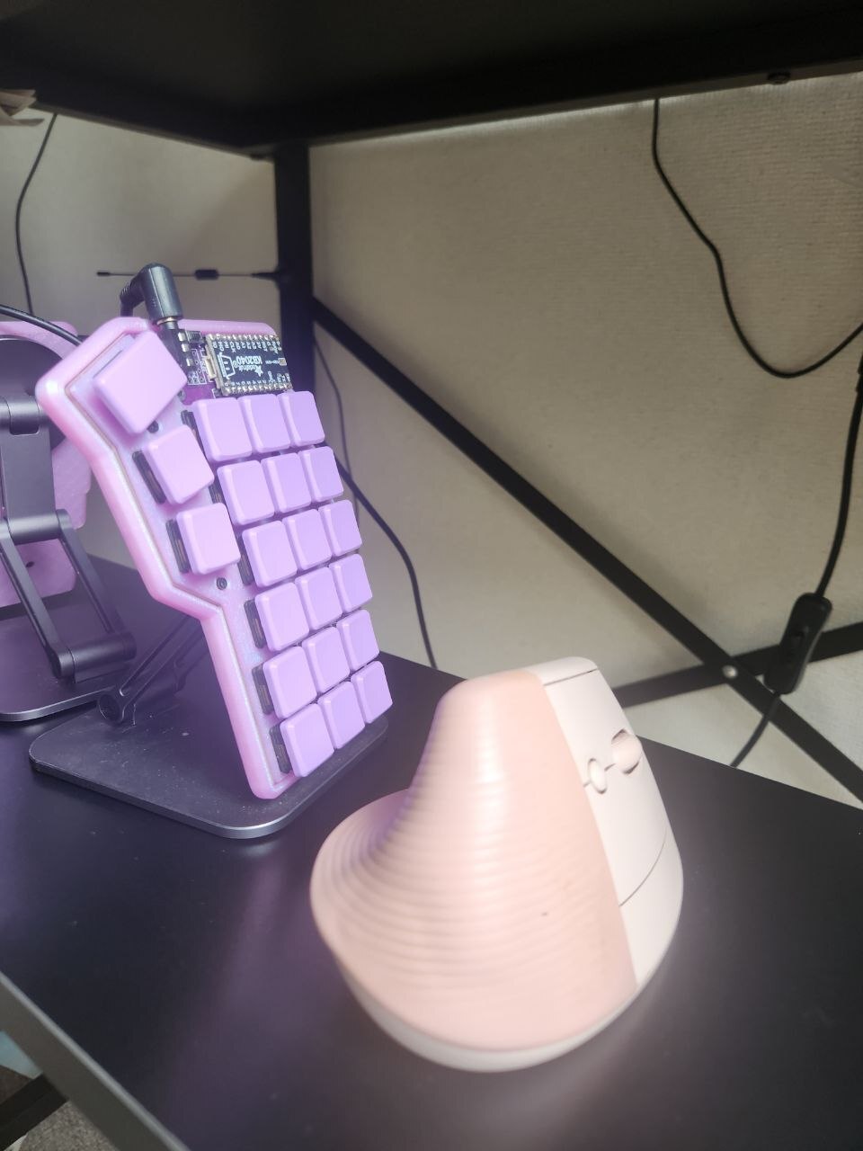 Keyboard in use next to a mouse